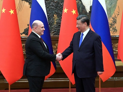 الرئيس الروسي شي جين بينج يستقبل رئيس الوزراء الروسي ميخائيل ميشوستين في العاصمة بكين. 24 مايو 2023 - via REUTERS