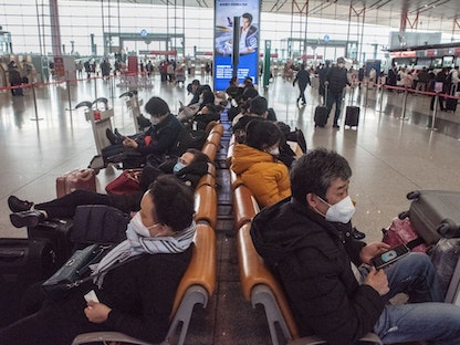 مسافرون في مطار بكين الدولي - 14 يناير 2023 - Bloomberg