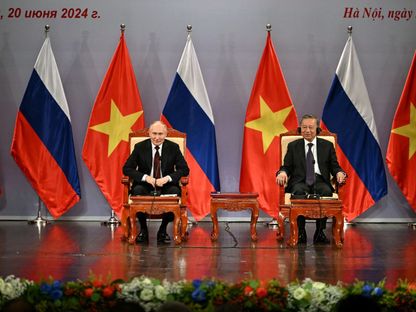 الرئيس الروسي فلاديمير بوتين ونظيره الفيتنامي تو لام في هانوي. 20 يونيو 2024 - REUTERS