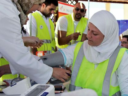 امرأة تخضع لقياس ضغط الدم في عمان، الأردن، 14 مايو 2010  - REUTERS