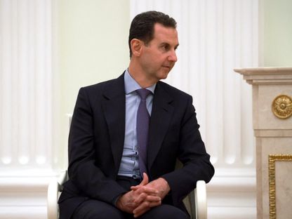 الرئيس السوري السابق بشار الأسد خلال اجتماع مع الرئيس الروسي فلاديمير بوتين في الكرملين بالعاصمة موسكو- 15 مارس 2023 - Reuters