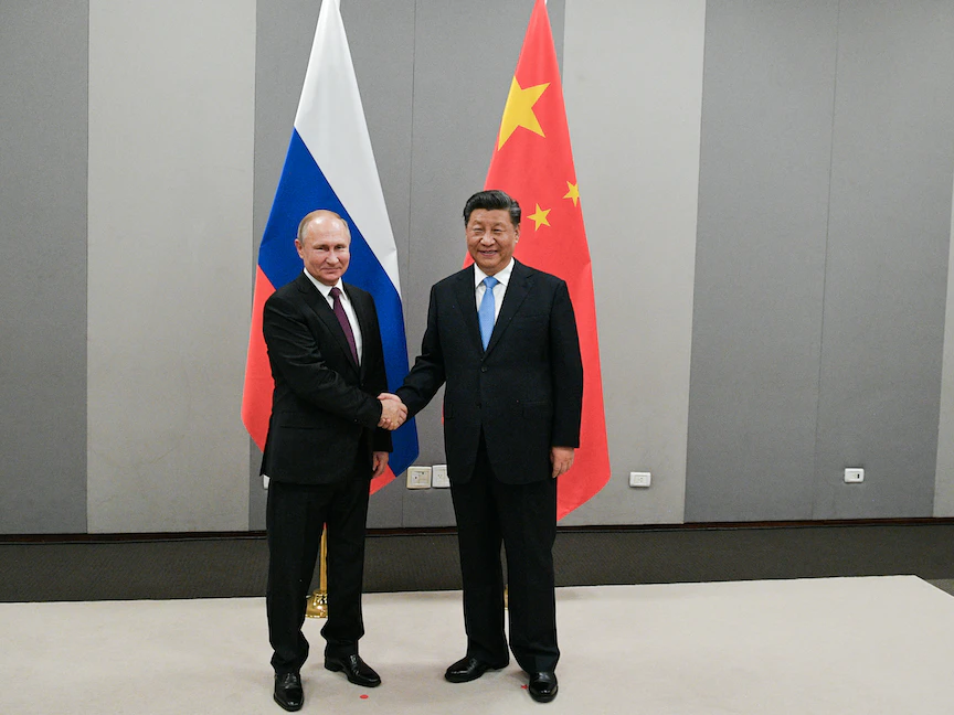 الرئيس الصيني شي جين بينغ ونظيره الروسي فلاديمير بوتين خلال قمة "بريكس" في البرازيل- 13 نوفمبر 2019 - VIA REUTERS