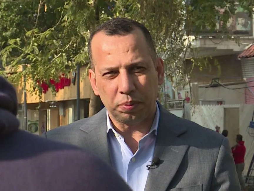 صورة ملتقطة من فيديو تُظهر هشام الهاشمي وهو يتحدث خلال مقابلة في بغداد - AFP