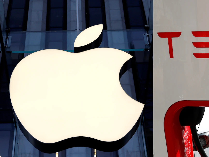 شعارات أبل ومايكروسوفت وتيسلا - REUTERS