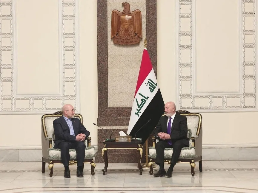 الرئيس العراقي نزار آميدي خلال لقائه مع رئيس البرلمان الإيراني محمد باقر قاليباف في بغداد. 19 أغسطس 2026 - REUTERS