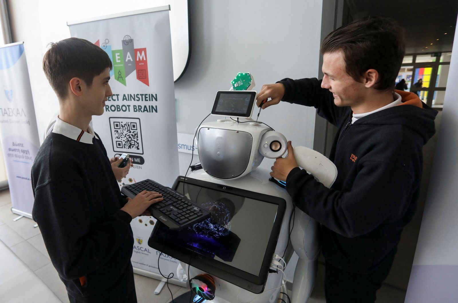 High school students Richard Erkhov and Vladimir Baranov work on 