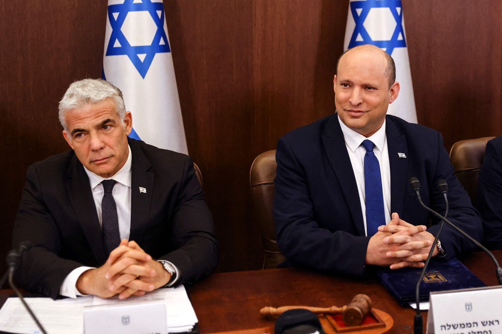 Israeli Prime Minister Naftali Bennett (R) and  Foreign Minister Yair Lapid attend a cabinet meeting at the Prime Minister's office in Jerusalem, on June 26, 2022. (Photo by RONEN ZVULUN / POOL / AFP) - AFP
