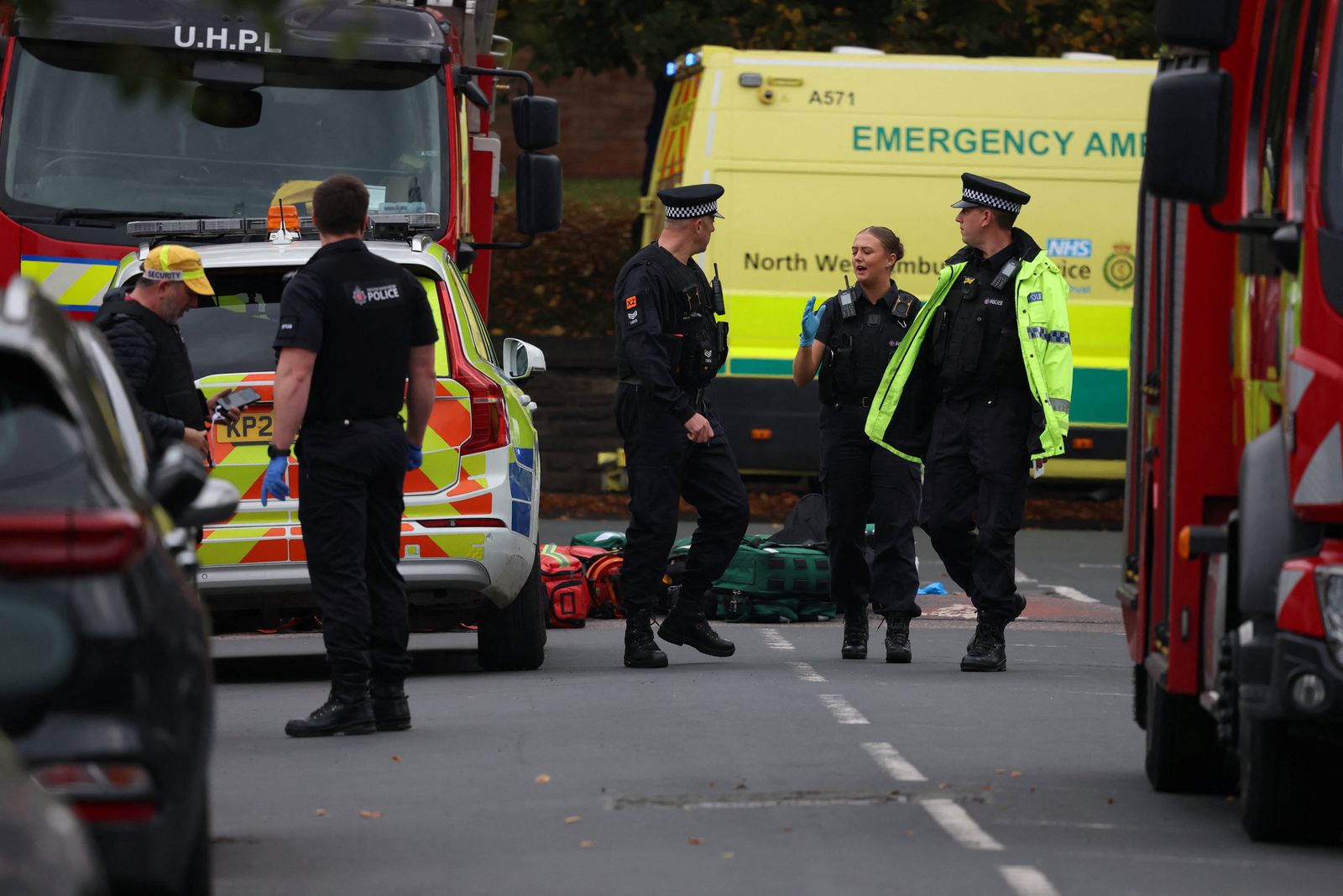 Emergency personnel work at the scene following an incident outside a synagogue in north Manchester, Britain, October 2, 2025. REUTERS/Phil Noble