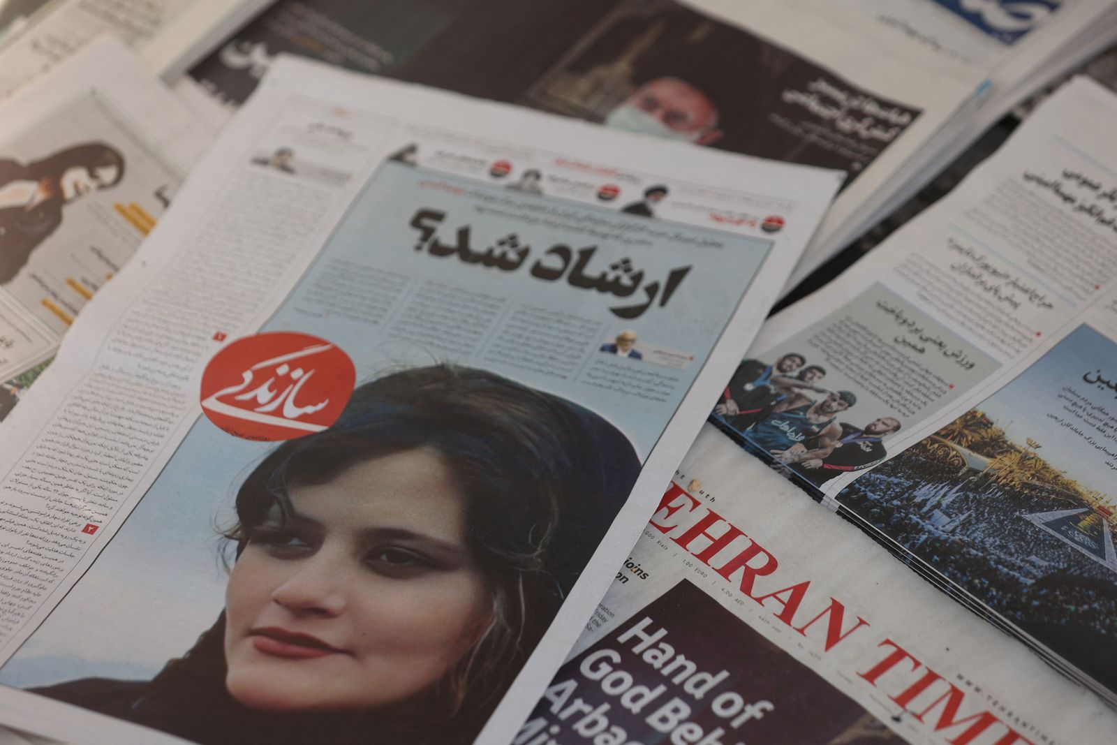 Newspapers with Amini, a victim of country's 