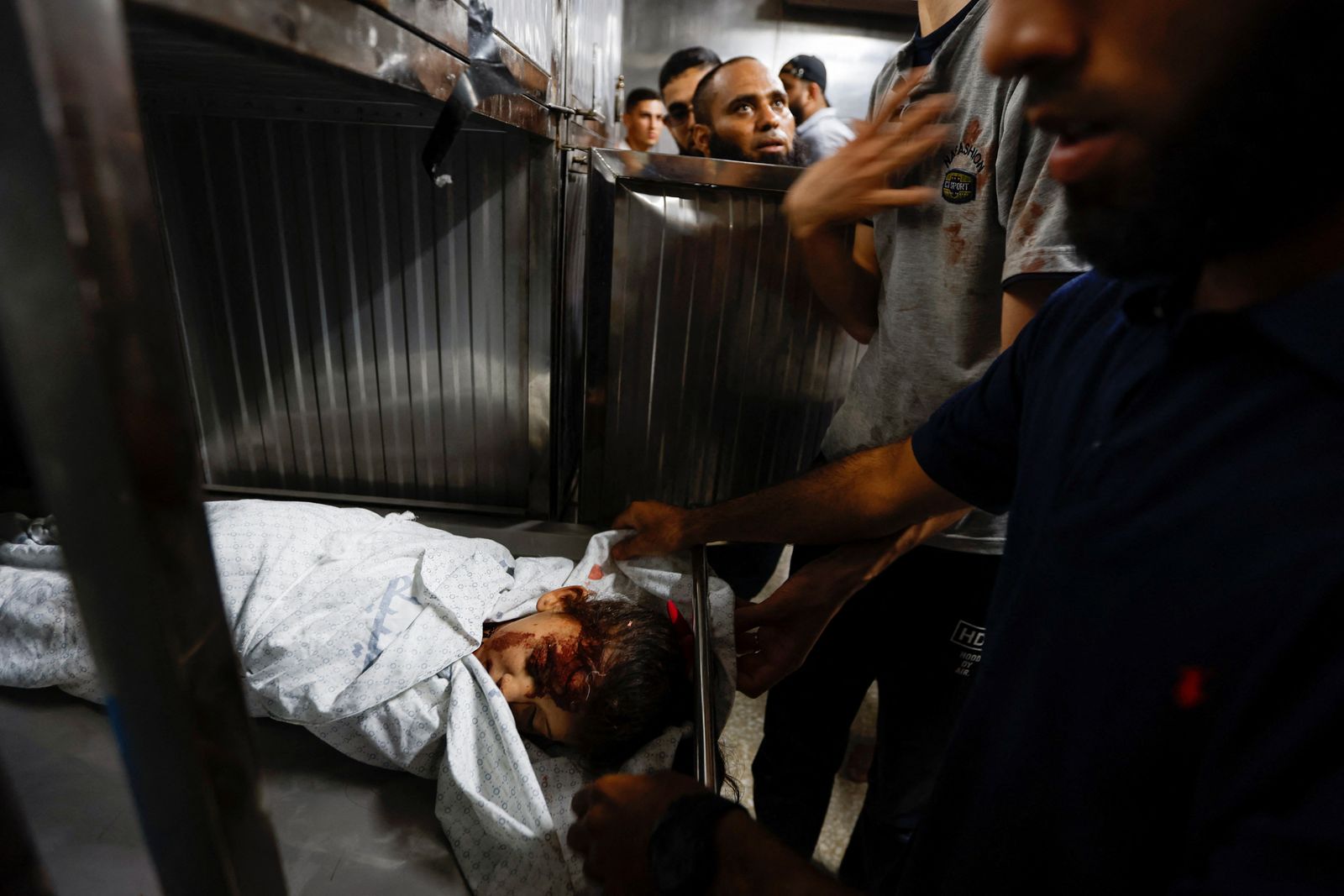 The body of a Palestinian girl is seen at a hospital after she was killed during Israeli strikes in Gaza City - REUTERS