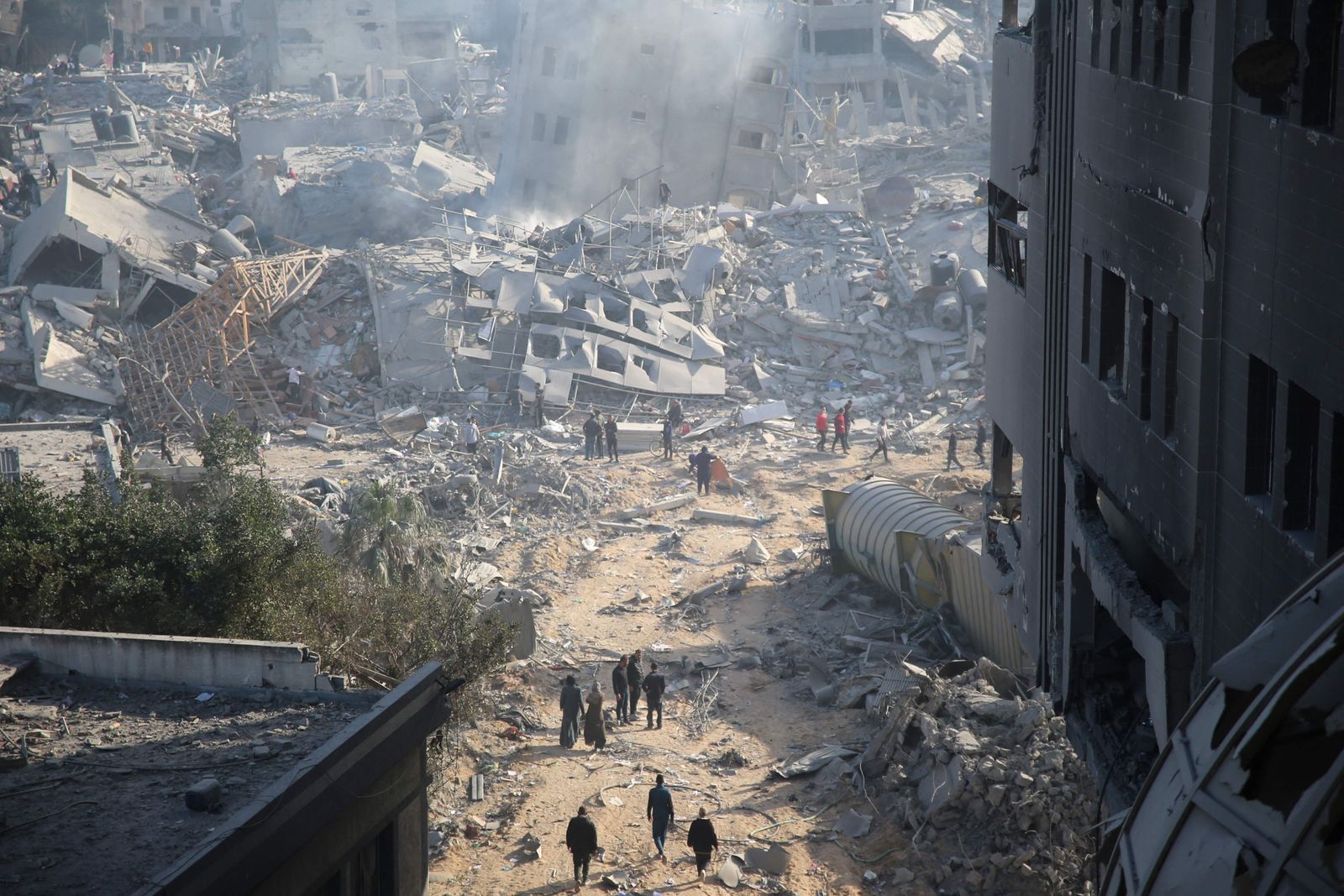 Palestinians inspect the damage at Gaza's Al-Shifa hospital after the Israeli military withdrew from the complex housing the hospital on April 1, 2024, amid the ongoing battles Israel and the Hamas militant group. (Photo by AFP)
