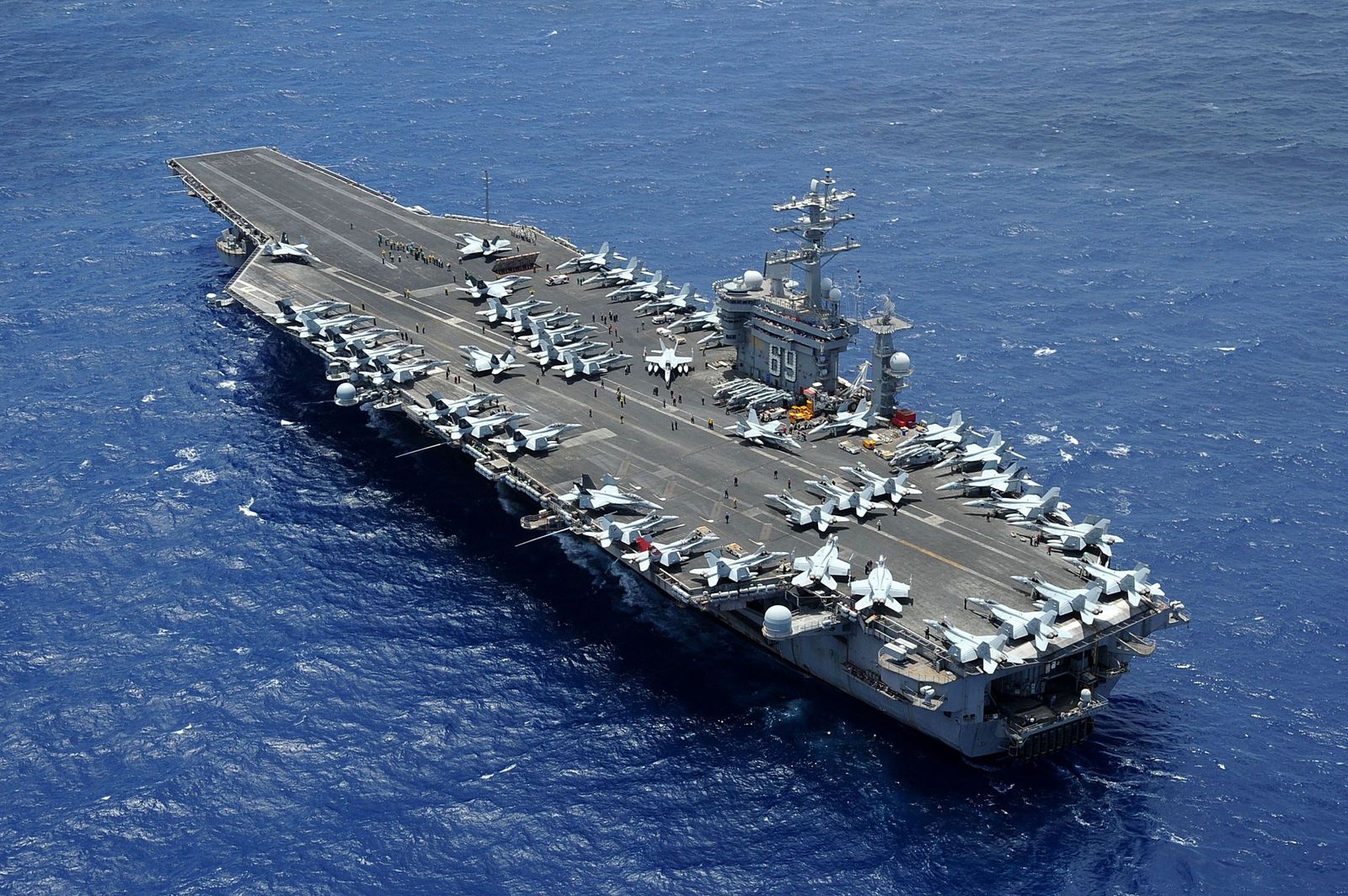 In this image released by the US Department of Defense, the aircraft carrier USS Dwight D. Eisenhower (CVN 69) is returning to homeport at Norfolk, Virginia after operating in the US 5th and 6th Fleet areas of responsibility in support of Operation Enduring Freedom on July 2, 2013. ABC News reported October 14 that Washington was sending the USS Eisenhower aircraft carrier strike group to support the USS Gerald R. Ford and its accompanying warships, which were already in the region. (Photo by Ryan D. McLearnon / US Department of Defense / AFP) / RESTRICTED TO EDITORIAL USE - MANDATORY CREDIT 'AFP PHOTO /  US Department of Defense/US Navy/Mass Communication Specialist 2nd Class Ryan D. McLearnon' - NO MARKETING NO ADVERTISING CAMPAIGNS - DISTRIBUTED AS A SERVICE TO CLIENTS