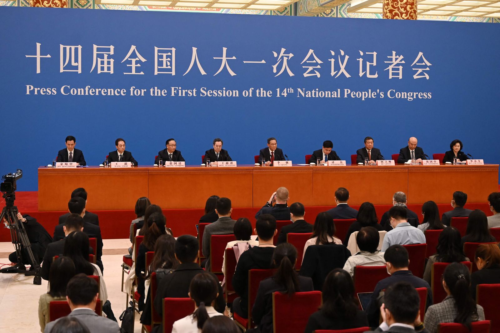 China's Premier Li Qiang (C)alongwith Vice Premiers Zhang Guoqing (3rd L), Ding Xuexiang (4th L), He Lifeng (3rd R) and Liu Guozhong (2nd R) attend a press conference after the closing session of the National People's Congress (NPC) at the Great Hall of the People in Beijing on March 13, 2023. (Photo by GREG BAKER / AFP) - AFP