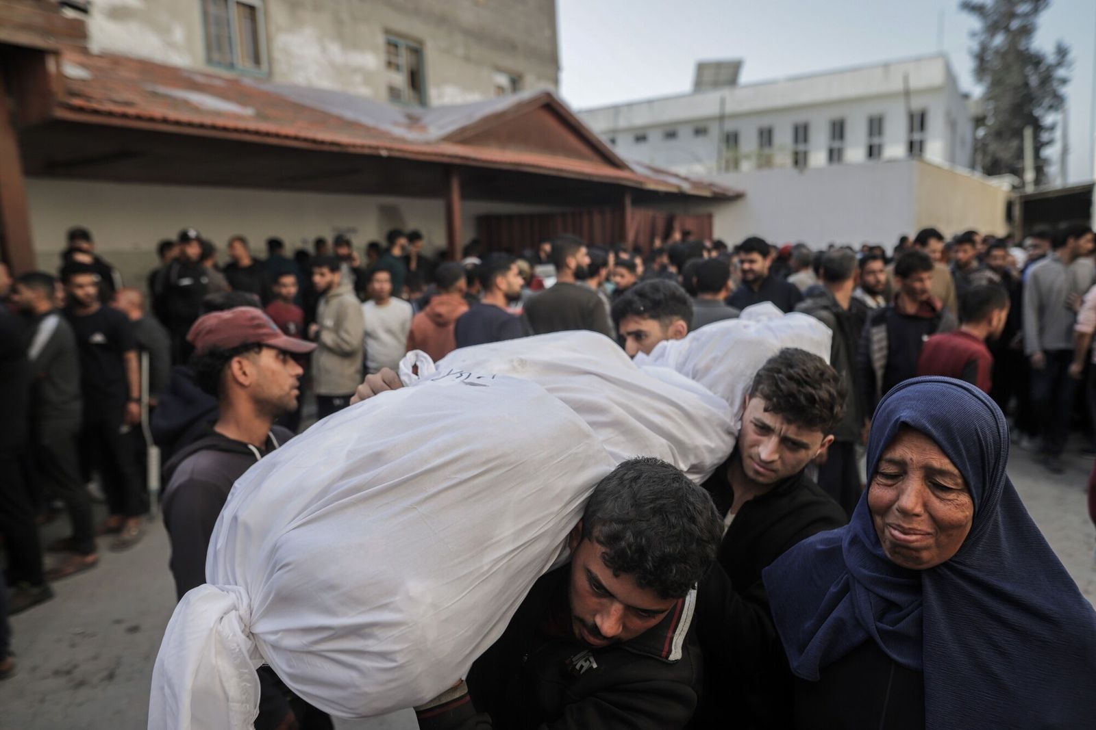 (EDITORS NOTE: Image depicts death.) Palestinians mourn the bodies of those killed during Israeli airstrikes at the Al-Ahli hospital in Gaza City, Gaza, on Tuesday, March 18, 2025. Israel launched overnight airstrikes across�Gaza�that Hamas said killed hundreds of people, shattering a nearly two-month ceasefire with the Palestinian group. Photographer: Ahmad Salem/Bloomberg