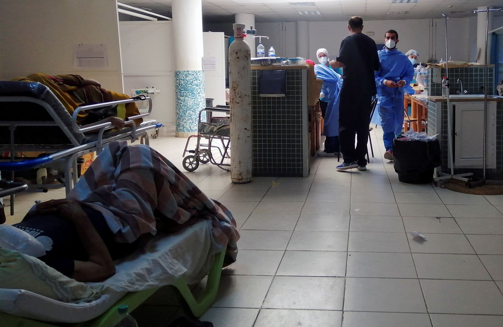 COVID-19 patients receive treatment at Charles Nicole Hospital in Tunis - REUTERS