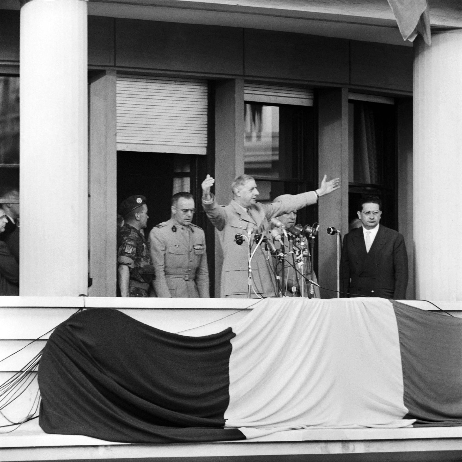 (FILES) In this file photo taken on June 4, 1958, French head of government General Charles de Gaulle (C) dressed in his general's uniform, delivers a speech from the balcony of the general Government building at the Forum in Algiers, during which he pronounced the famous sentence 