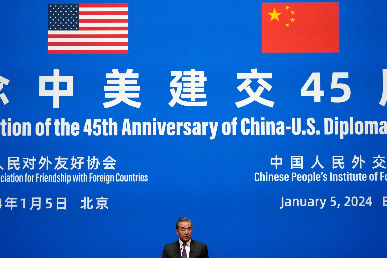 Chinese Foreign Minister Wang Yi delivers a speech at a reception to commemorate the 45th anniversary of China-US diplomatic relations at the Diaoyutai Guest House in Beijing on January 5, 2024. (Photo by Andy Wong / POOL / AFP)