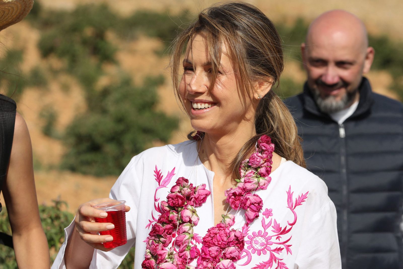 Syrian First Lady Asma al-Assad attends the harvest of Damascena (Damask) roses in the village of al-Marah, in the Damascus countryside, on May 25, 2023. (Photo by LOUAI BESHARA / AFP)