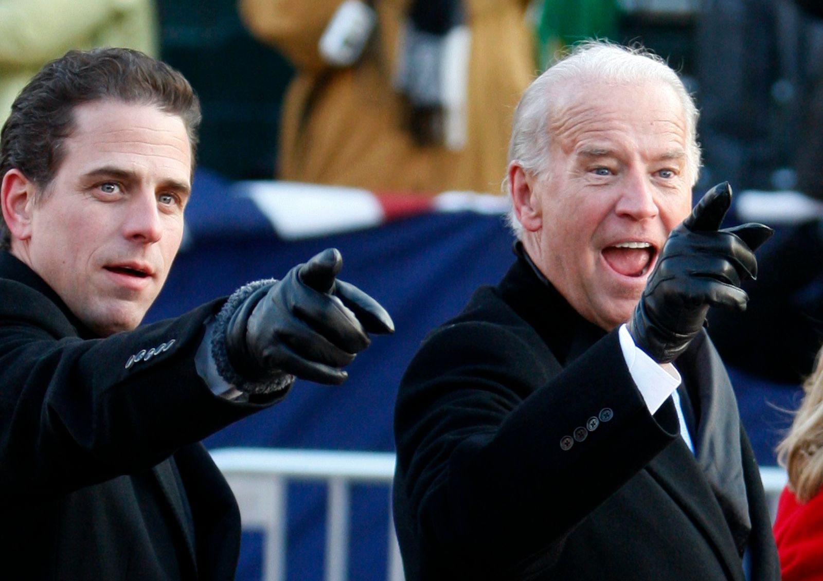 U.S. Vice President Biden and son Hunter gesture as they walk down Pennsylvania Avenue - REUTERS