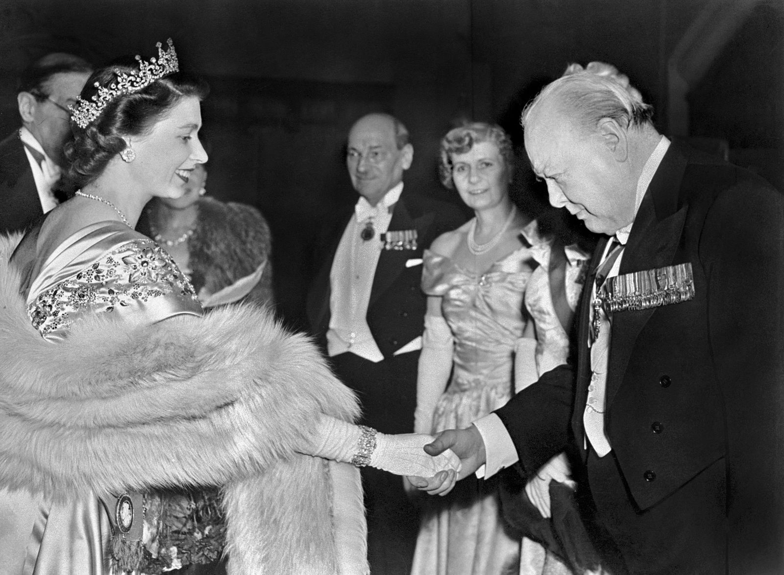 (FILES) In this file photo taken on March 23, 1950 The Princess Elizabeth of Great Britain greets Winston Churchill at a Guildhall reception, in London. - From a string of US presidents to Lady Gaga, Queen Elizabeth II met leading political and artistic personalities from around the globe during her record-breaking time on the throne. Some were despised dictators, others world-famous guitarists she made polite conversation with. Regardless of the personalities, she always kept her composure. (Photo by - / AFP) - AFP