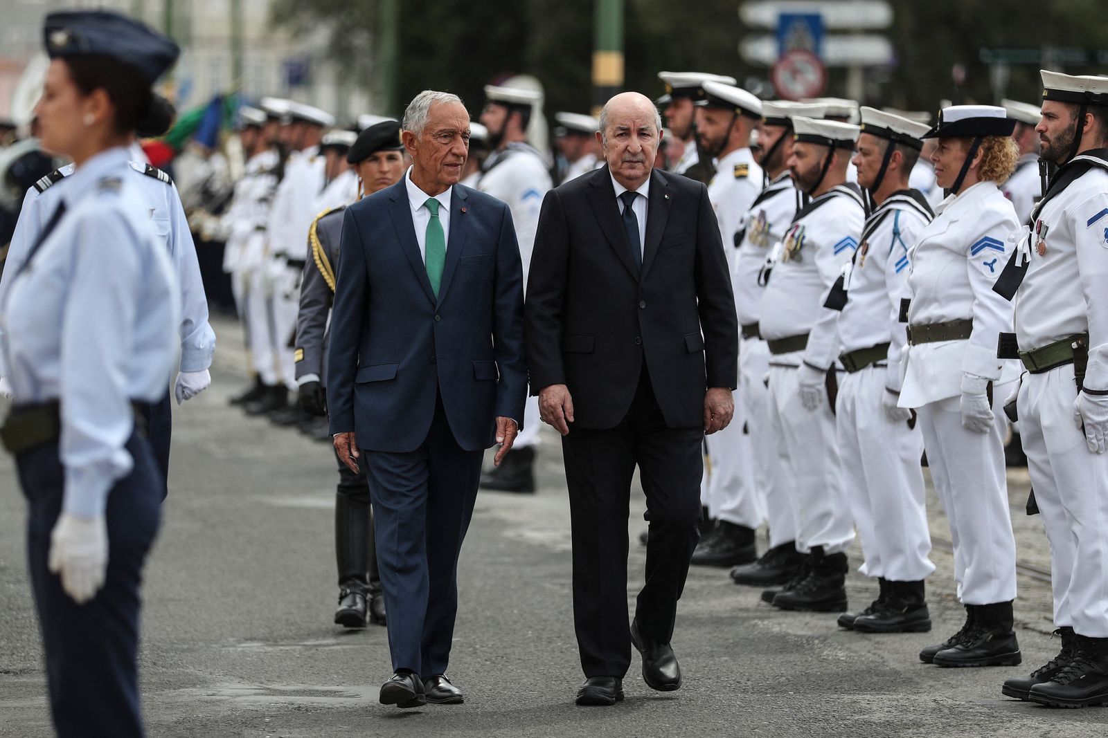 Portugual's President Marcelo Rebelo de Sousa and Algeria's President Abdelmadjid Tebboune (L) review the troops at the Jeronimos Monastery in Lisbon on May 23, 2023. (Photo by CARLOS COSTA / AFP) - AFP