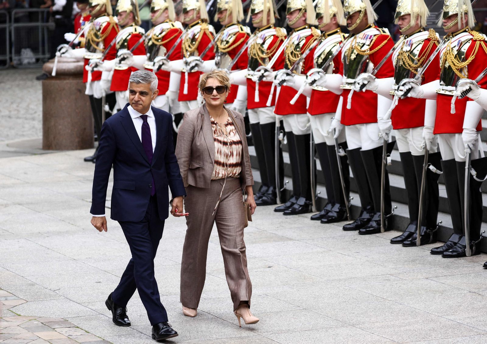 Mayor of London Sadiq Khan and his wife Saadiya arrive to attend the National Service of Thanksgiving for The Queen's reign at Saint Paul's Cathedral in London on June 3, 2022 as part of Queen Elizabeth II's platinum jubilee celebrations. - Queen Elizabeth II kicked off the first of four days of celebrations marking her record-breaking 70 years on the throne, to cheering crowds of tens of thousands of people. But the 96-year-old sovereign's appearance at the Platinum Jubilee -- a milestone never previously reached by a British monarch -- took its toll, forcing her to pull out of a planned church service. (Photo by HENRY NICHOLLS / POOL / AFP) - AFP