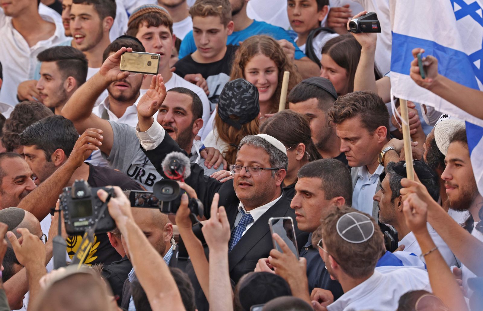 Itamar Ben-Gvir, Israeli far-right lawmaker and leader of the Otzma Yehudit (Jewish power) party, joins demonstrators gathering with Israeli flags during the Israeli 'flags march' to mark 