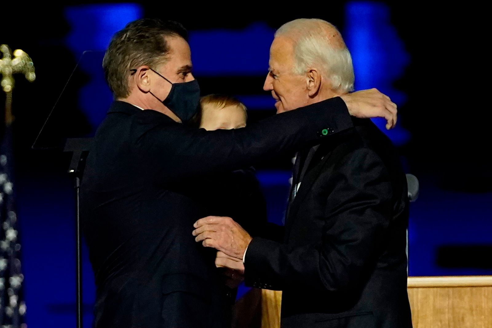 (FILES) In this file photo taken on November 07, 2020 US President-elect Joe Biden (R) embraces his son Hunter Biden (L) on stage after delivering remarks in Wilmington, Delaware. - US President-elect Joe Biden's son Hunter, a frequent target of Republican attacks during the 2020 election campaign, said December 9, 2020, he is under investigation for potential tax violations. (Photo by Andrew Harnik / POOL / AFP) - AFP
