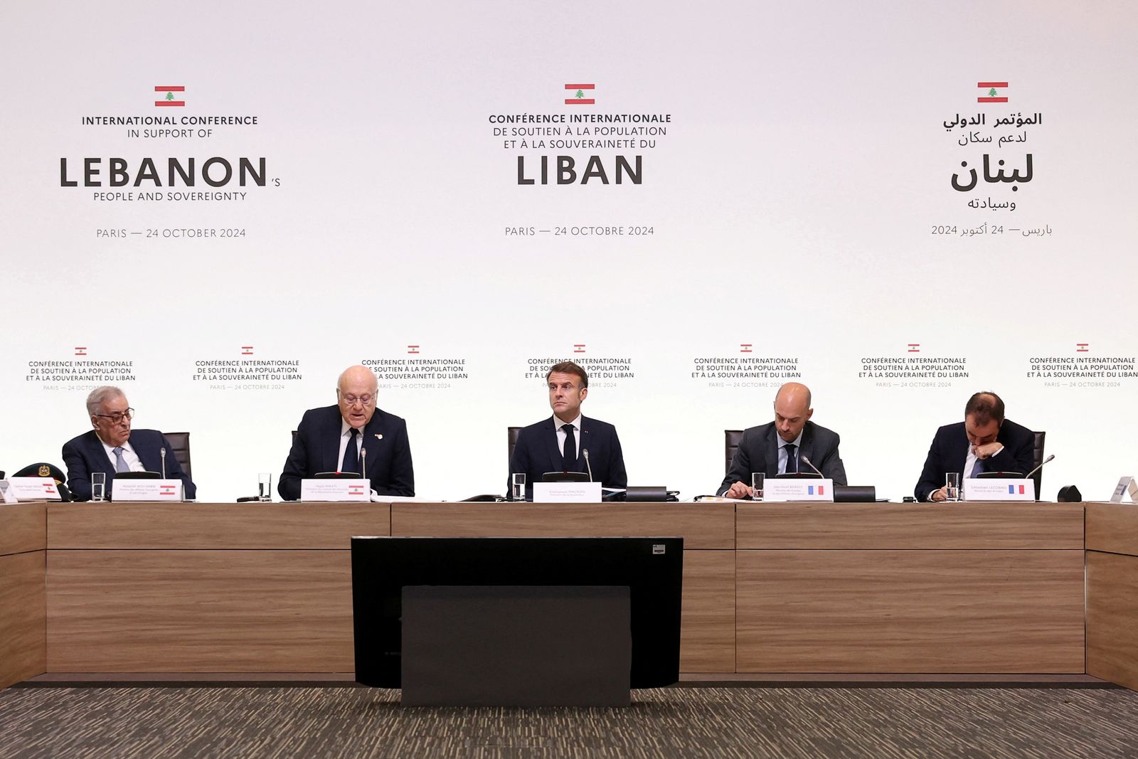 Lebanon's Prime Minister Najib Mikati speaks next to France's President Emmanuel Macron, Lebanon's Foreign Affairs Minister Abdallah Bou Habib, France's Foreign Affairs Minister Jean-Noel Barrot and France's Minister of the Armed Forces Sebastien Lecornu during an international press conference in support of Lebanon, in Paris, France on October 24, 2024. ALAIN JOCARD/Pool via REUTERS