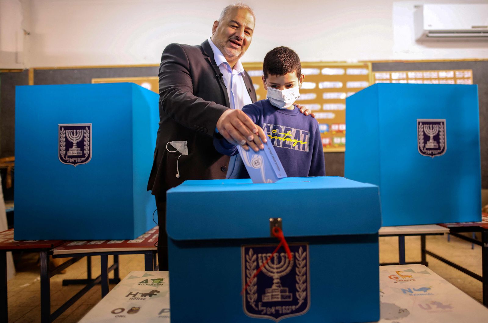 Mansour Abbas, leader of the United Arab List, votes in Israel's fourth national election in two year at a polling statino in the northern village of Maghar on March 23, 2021. (Photo by Ahmad GHARABLI / AFP) - AFP