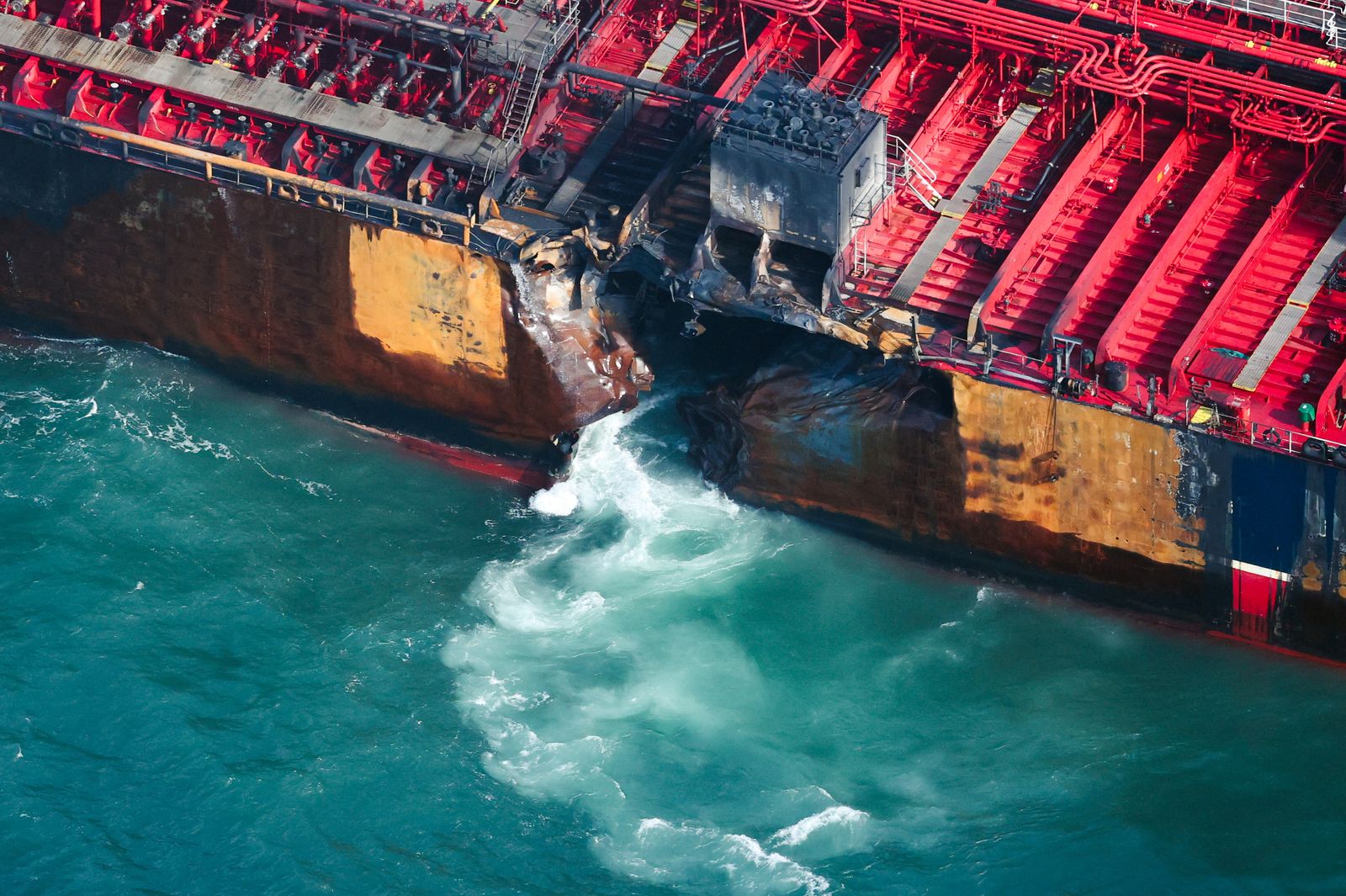 Water flows through a damaged hull of Stena Immaculate oil tanker ship after it collided with a cargo ship off the northeastern coast of England, Britain, March 11, 2025. REUTERS/Phil Noble