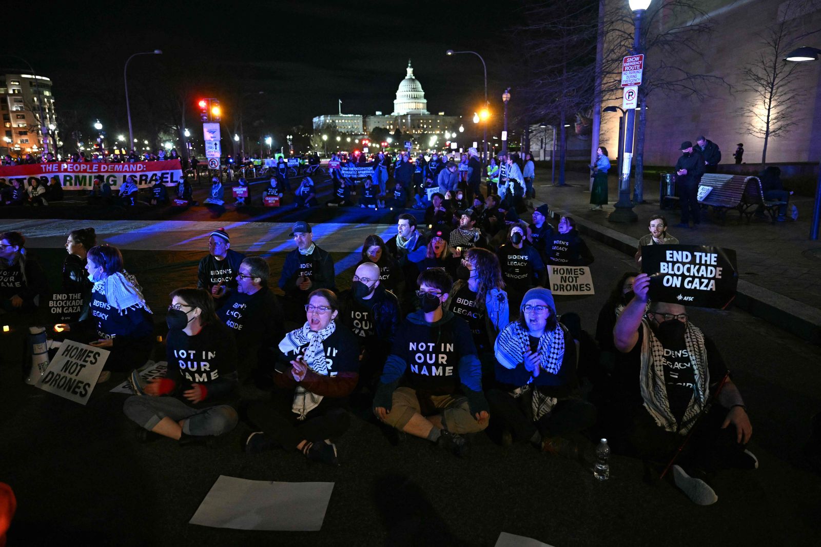 Pro-Palestinian demonstrators block a street during a protest ahead of US President Joe Biden's State of the Union address near the US Capitol in Washington, DC, on March 7, 2024. (Photo by PEDRO UGARTE / AFP)
