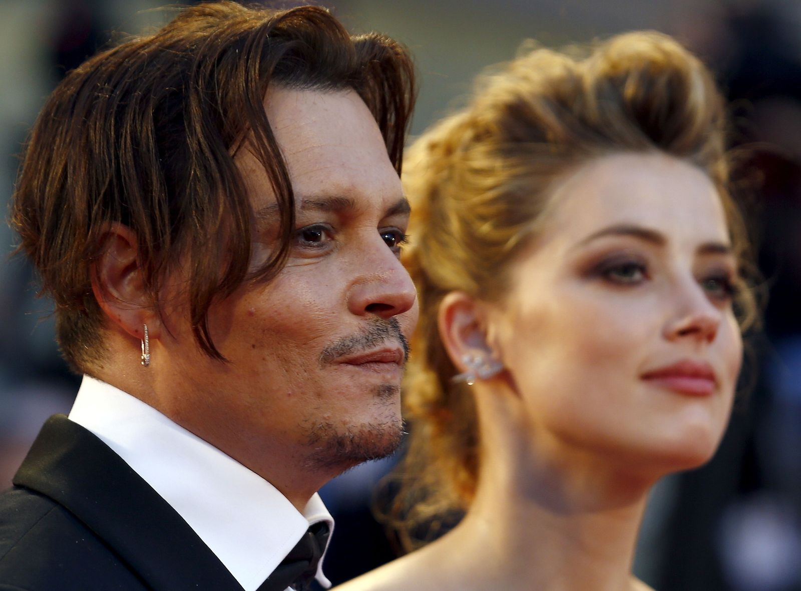 FILE PHOTO: Actress Amber Heard and her husband Johnny Depp attend the red carpet event for the movie 