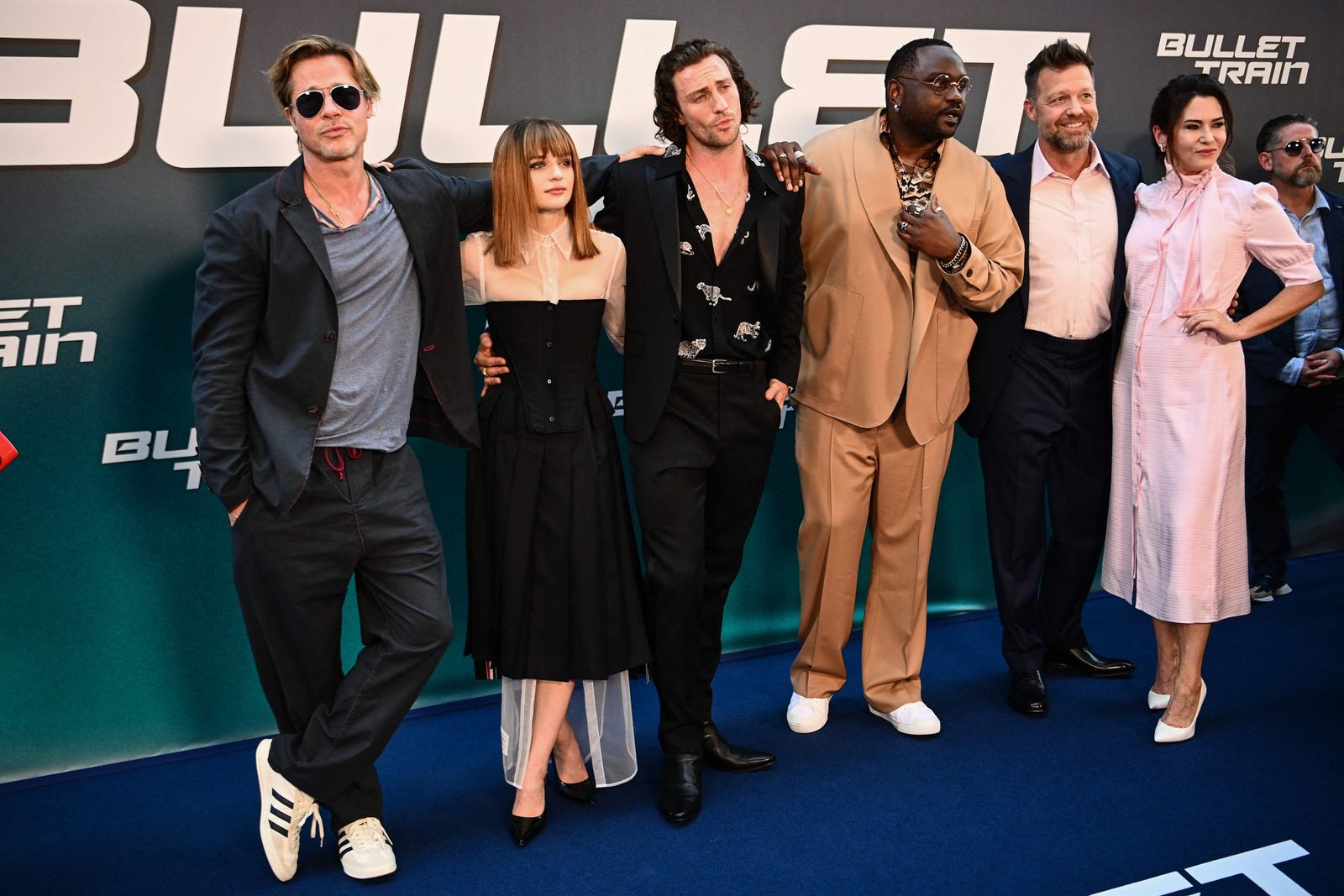 (From L to R) US actor Brad Pitt, US actresses Joey King, British actor Aaron Taylor-Johnson, US actor Brian Tyree Henry, US Director David Leitch and US Executive producer Kelly McCormick pose for a photo during a preview of the film (Bullet Train) in Paris on July 18, 2022. - Come to present the comedy 