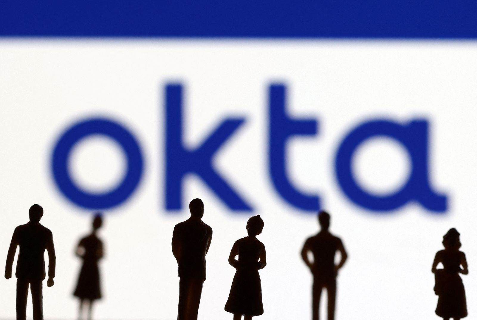 People's miniatures are seen in front of Okta logo in this illustration taken March 22, 2022. REUTERS/Dado Ruvic/Illustration - REUTERS