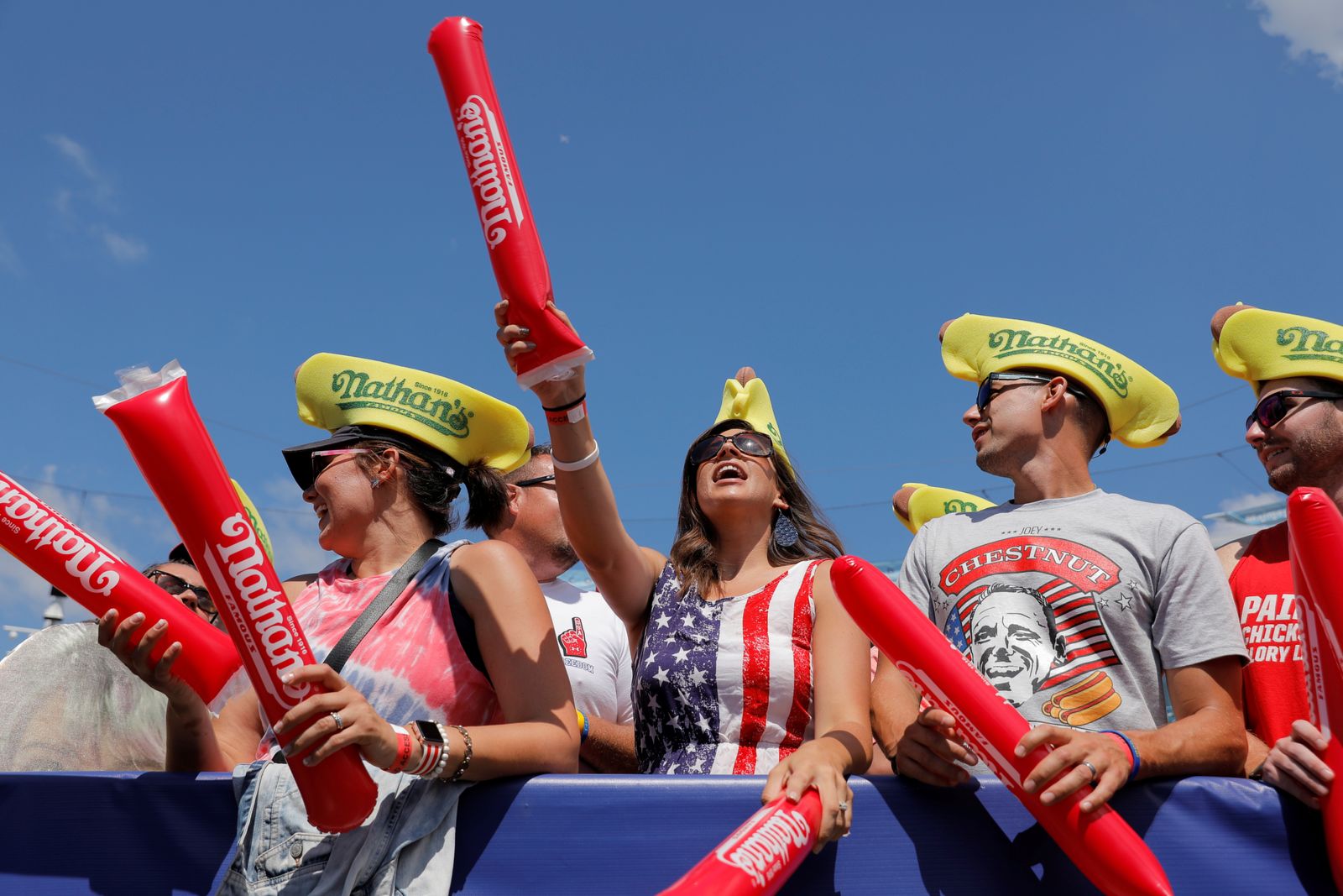 People cheer ahead of the Nathan's Famous Fourth of July Hot Dog-Eating Contest held on Independence Day at Maimonides Park in Brooklyn, New York City - REUTERS
