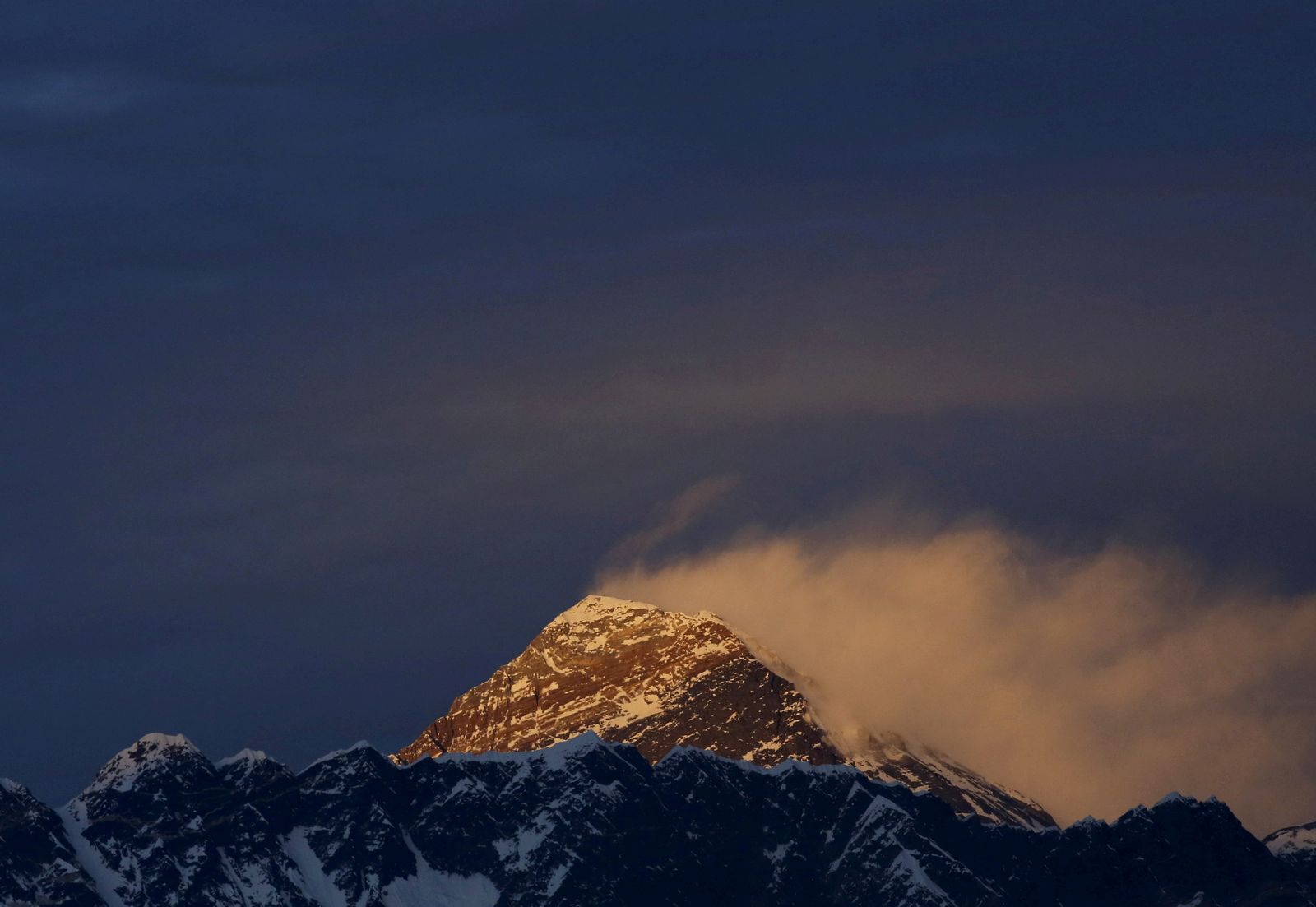 FILE PHOTO: Light illuminates Mount Everest, during sunset in Solukhumbu District also known as the Everest region - REUTERS
