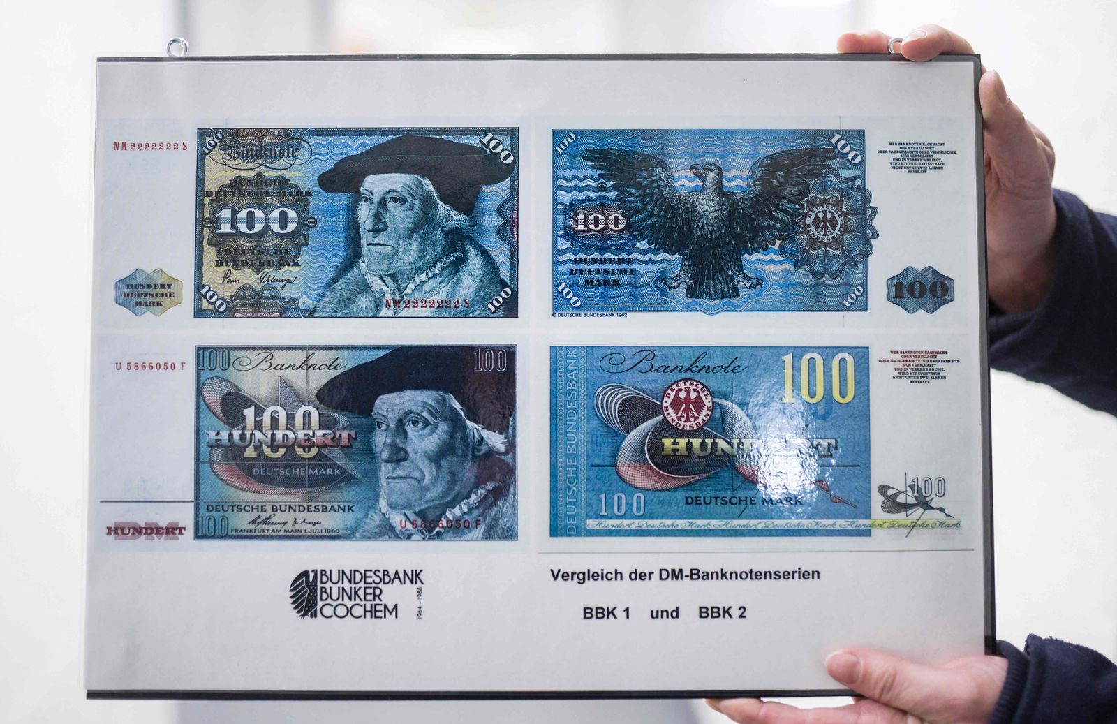 A photo taken on February 8, 2022 shows a picture of the original and substitute 100 Mark notes in the former vault of the Bundesbank Bunker Museum in Cochem, western Germany. - The Bundesbank Bunker was a bunker of the German Federal Bank in Cochem for the storage of an emergency currency. From 1964 to 1988, up to 15 billion marks were stored in the top-secret facility to protect Germany from a national economic crisis in the event of hyperinflation caused by the Cold War. (Photo by Ina FASSBENDER / AFP) - AFP
