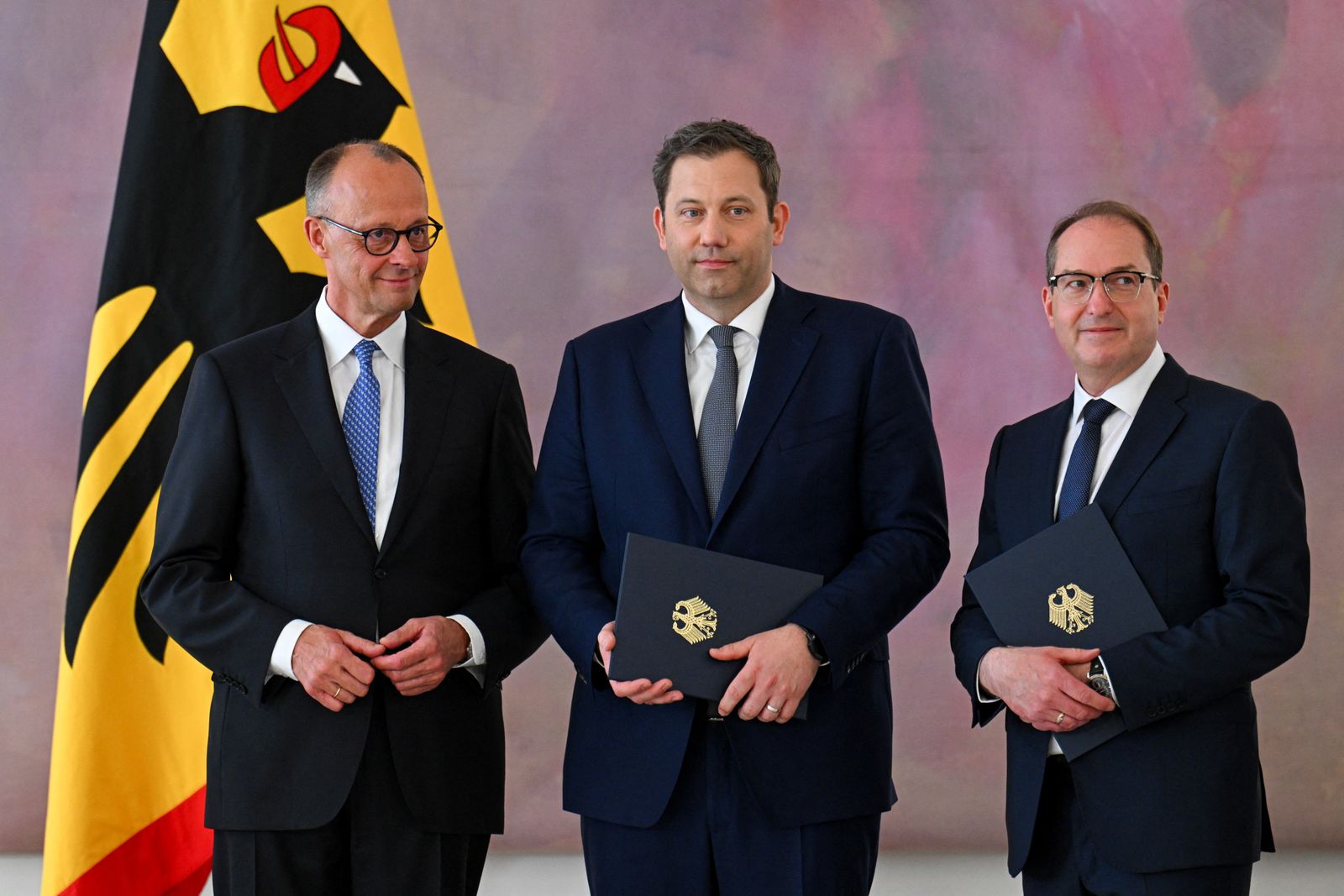 German Chancellor Friedrich Merz, along with designated Vice Chancellor and designated German Finance Minister Lars Klingbeil, and designated German Interior Minister Alexander Dobrindt, attend a ceremony where they receive their certificates of appointment from German President Frank-Walter Steinmeier at Bellevue Palace in Berlin, Germany May 6, 2025. REUTERS/Annegret Hilse