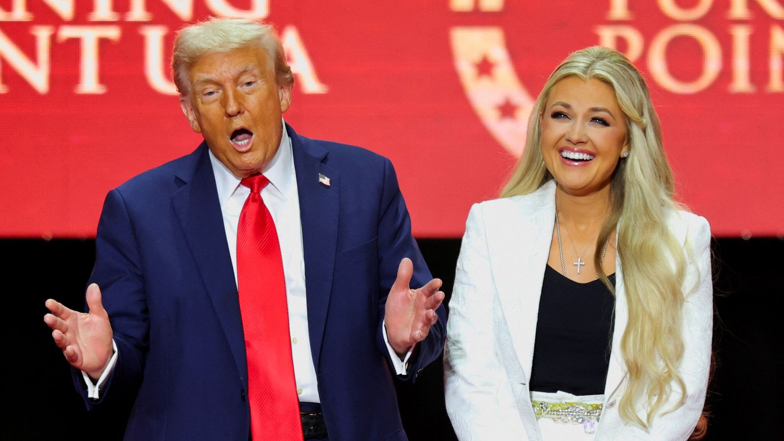 U.S. President Donald Trump and Erika Kirk, Charlie Kirk's widow, react onstage during a memorial service for slain conservative commentator Charlie Kirk at State Farm Stadium, in Glendale, Arizona, U.S., September 21, 2025.  REUTERS/Daniel Cole