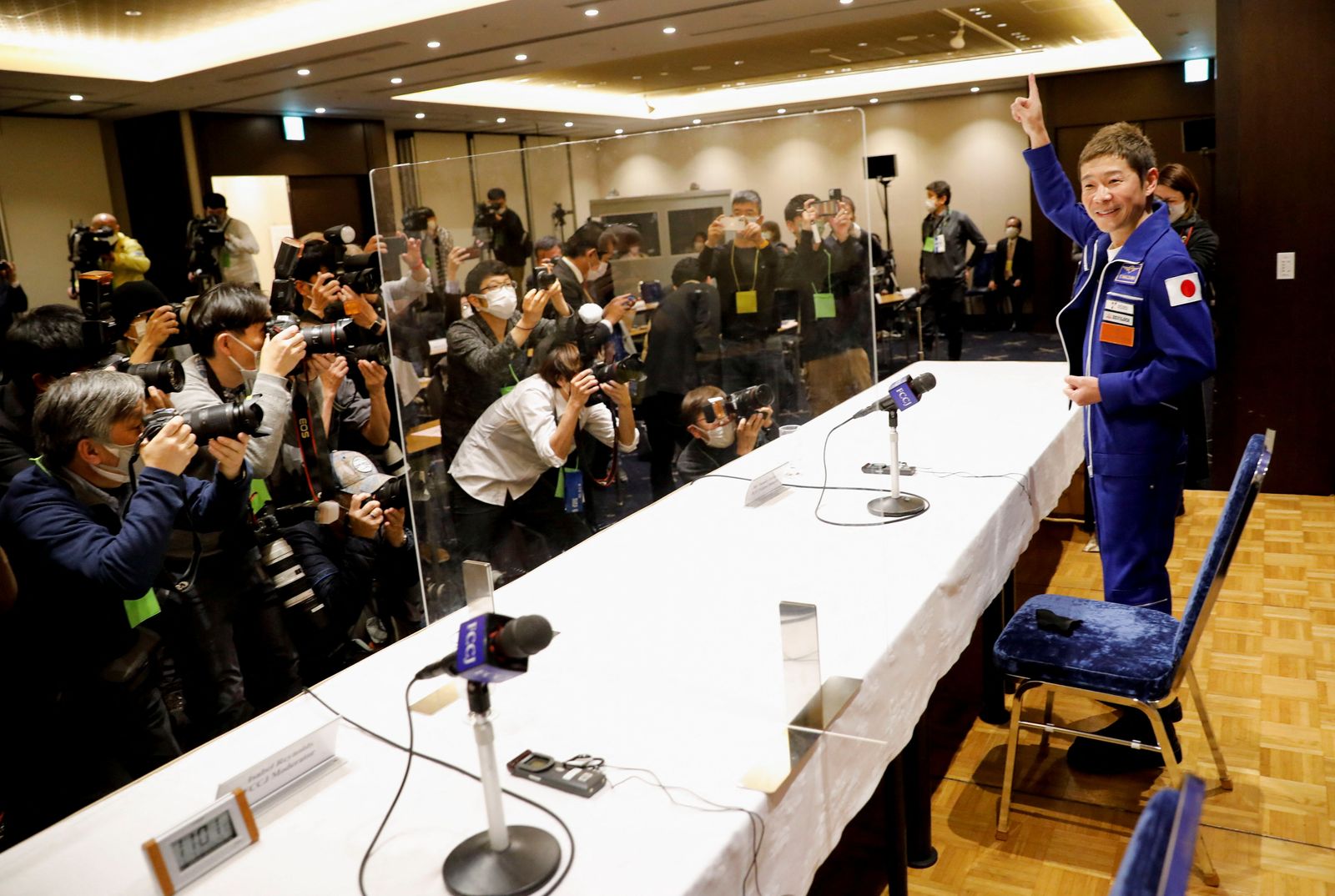 Japanese billionaire Yusaku Maezawa  attends a news conference after returning to Japan after a journey into space in Tokyo - REUTERS