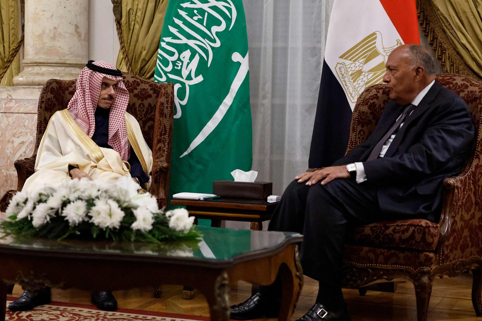 Egypt's Foreign Minister Sameh Shoukry (R) meets with his Saudi counterpart Faisal bin Farhan in Cairo on January 28, 2024. (Photo by Khaled DESOUKI / AFP)