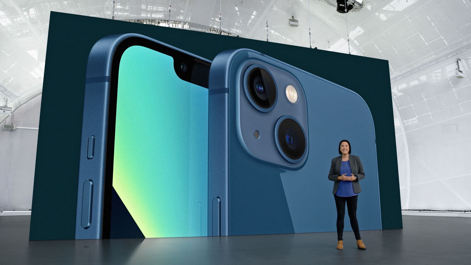 this handout image obtained September 14, 2021 courtesy of Apple Inc. shows Apple's Kaiann Drance showcases the new iPhone 13 during a special Apple event, as seen in this still image from the keynote video. (Photo by Handout / Apple Inc. / AFP) / RESTRICTED TO EDITORIAL USE - MANDATORY CREDIT 