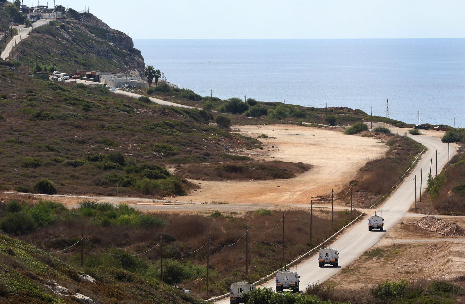 A United Nations peacekeeping force (UNIFIL) convoy advances towards the last checkpoint for the Lebanese army in the southernmost area of Naqura, by the border with Israel, on October 13, 2020. - Lebanon and Israel, which are still technically at war, had agreed to begin UN-brokered negotiations on October 14 over the shared frontier, a particularly sensitive issue as Lebanon wants to drill for hydrocarbons in a part of the Mediterranean disputed by Israel. (Photo by Mahmoud ZAYYAT / AFP) - AFP