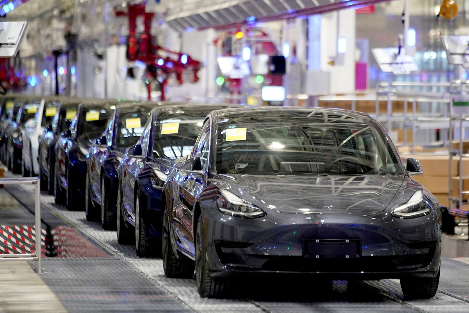 FILE PHOTO: FILE PHOTO: Tesla China-made Model 3 vehicles are seen during a delivery event at the carmaker's factory in Shanghai, China - REUTERS