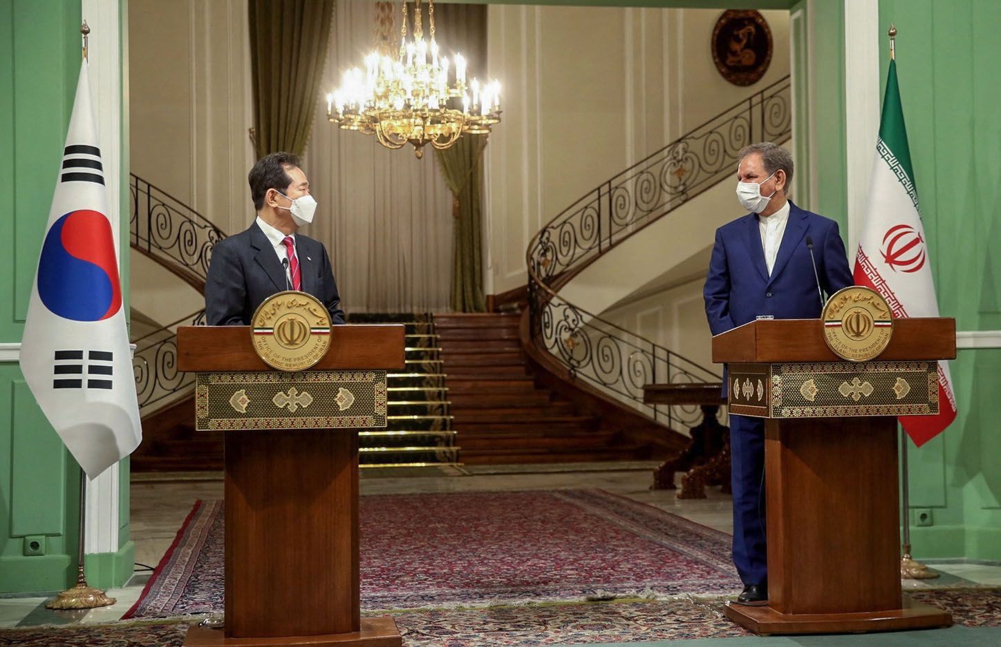 A handout picture provided by the official website of Iran's Vice President on April 11, 2021 shows Vice-President Eshaq Jahangiri (R) and South Korea's Prime Minister Chung Sye-kyun during a joint press conference after their meeting in Tehran. (Photo by - / Iranian Vice-Presidency / AFP) / XGTY / === RESTRICTED TO EDITORIAL USE - MANDATORY CREDIT 