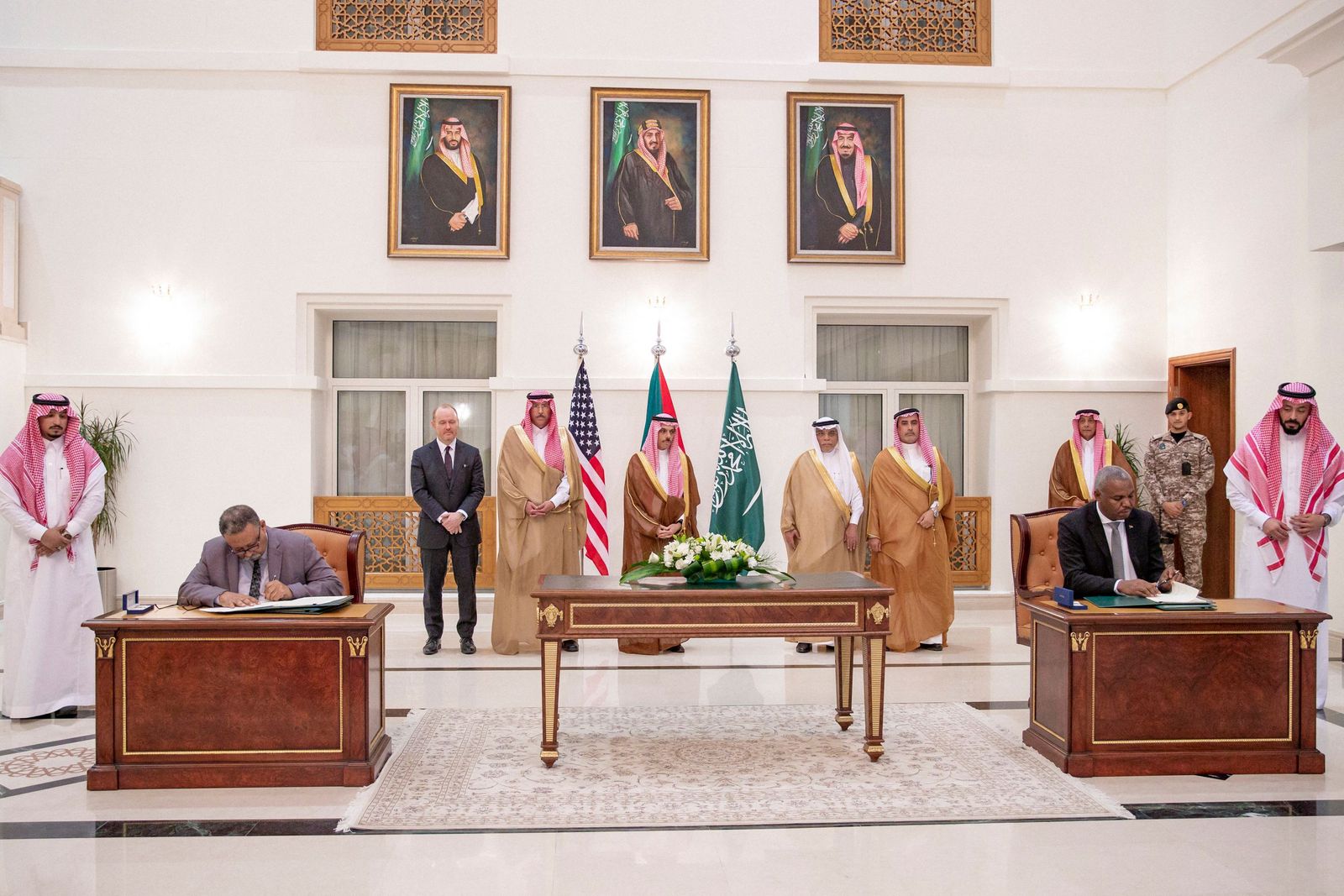 A handout picture provided by the Saudi Press Agency (SPA) on May 21, 2023, shows Saudi Foreign Minister Faisal bin Farhan (C) attending the signing of a truce agreement between representatives of the Sudanese army and the rival Paramilitary Rapid Support forces in Jeddah. With heavy fighting raging in Khartoum, the rival sides struck a deal on a seven-day ceasefire beginning the evening of May 22, the United States and Saudi Arabia said on May 21 in a joint statement after talks in Jeddah. (Photo by SPA / AFP) / === RESTRICTED TO EDITORIAL USE - MANDATORY CREDIT 'AFP PHOTO / HO / SPA' - NO MARKETING NO ADVERTISING CAMPAIGNS - DISTRIBUTED AS A SERVICE TO CLIENTS ===