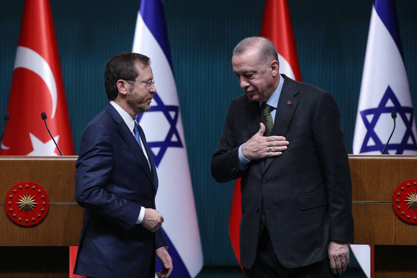 Israeli President Isaac Herzog (L) stands next to his Turkish counterpart Tayyip Erdogan after a press conference in Ankara, on March 9, 2022. (Photo by AFP) - AFP