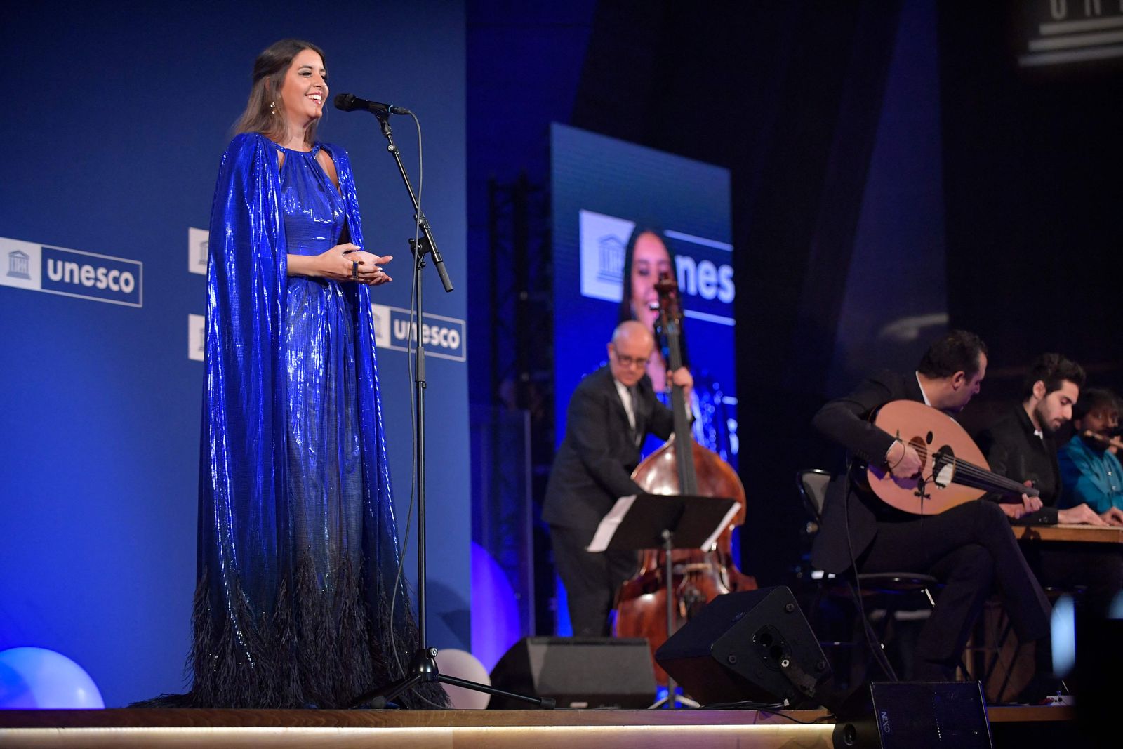 Egyptian singer Farrah El Dibany performs during the 75th anniversary celebrations of The United Nations Educational, Scientific and Cultural Organization (UNESCO) at UNESCO headquarters in Paris on November 12, 2021. (Photo by JULIEN DE ROSA / POOL / AFP) - AFP