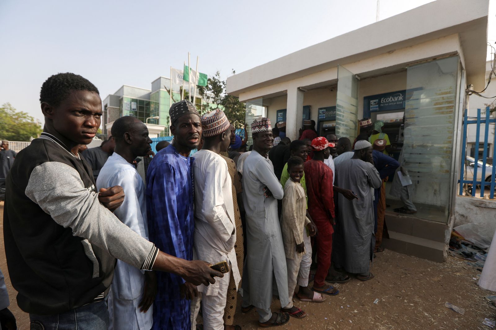 People queue to withdraw cash from an ATM at a bank, ahead of presidential elections, in Zamfara - REUTERS